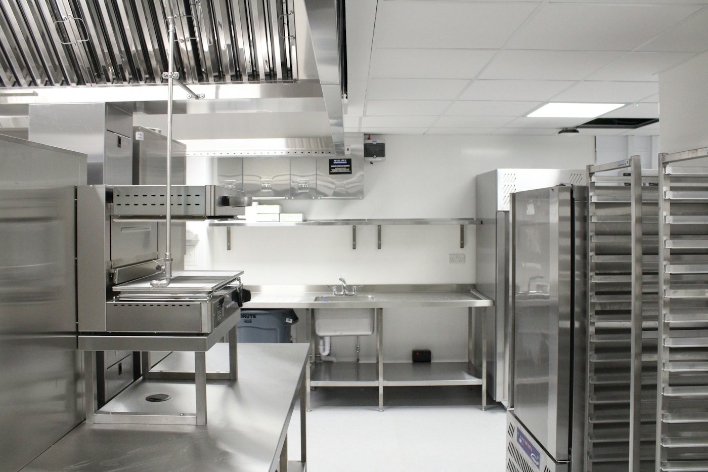 Commercial kitchen with exposed exhaust ductwork